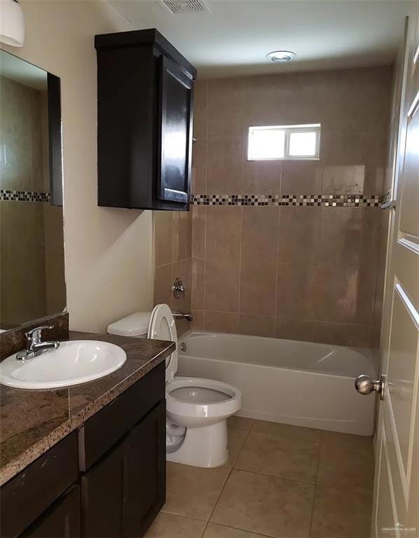 Bathroom with vanity, light tile patterned flooring, and shower / bathtub combination
