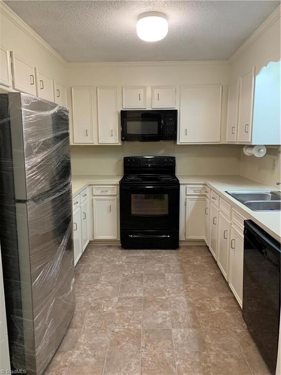 Kitchen with new flooring and new stainless steel refrigerator