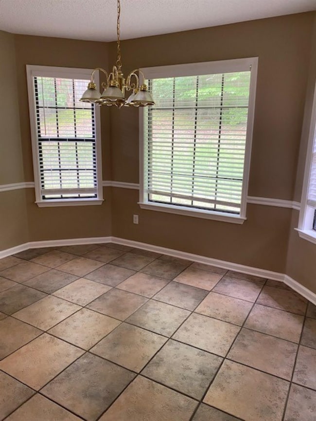 Look at the size of this eating area with a beautiful bay window overlooking your rear yard!