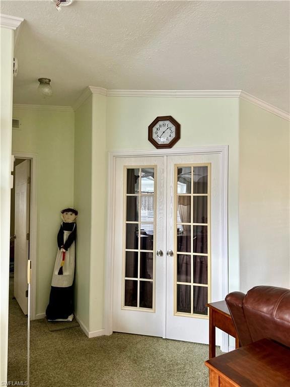 Doorway featuring crown molding, carpet, a textured ceiling, and french doors