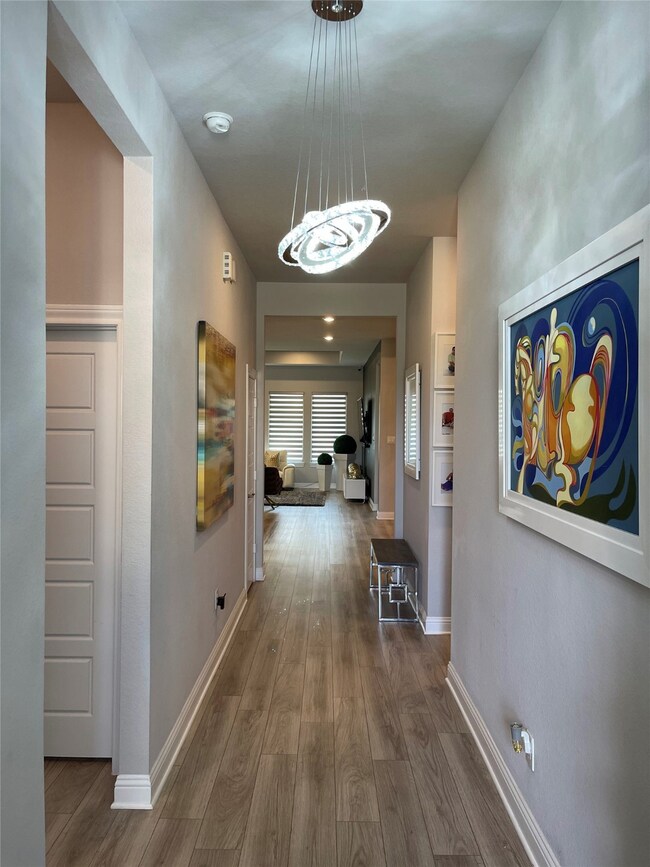 Long entrance foyer with classic and enticing decor lights