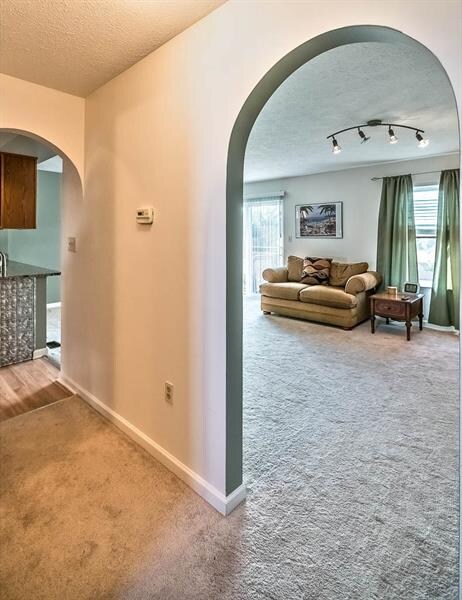 Arched entries into Living Room and Kitchen