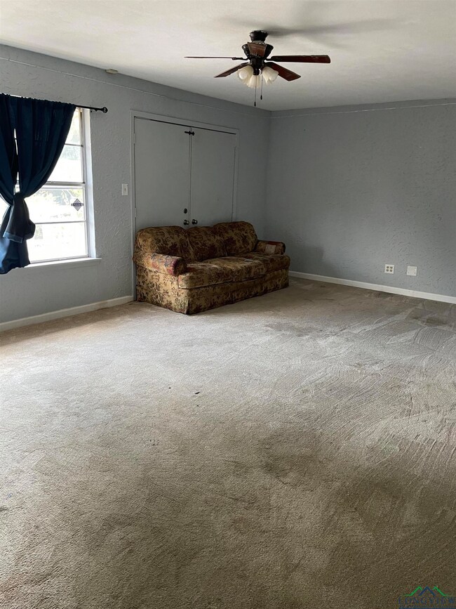 Unfurnished room with carpet flooring and ceiling 
