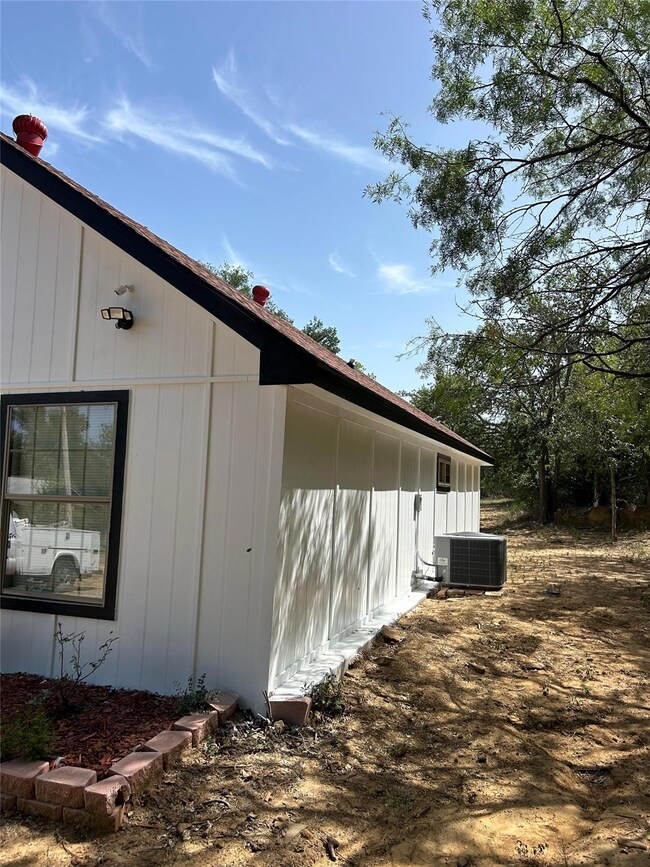 View of home's exterior featuring central AC