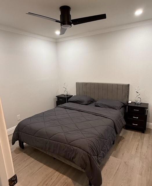 Bedroom with light wood-type flooring, ornamental
