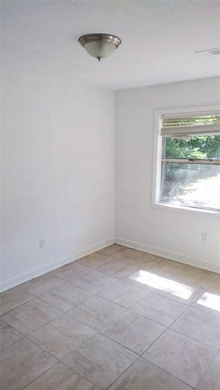 View of tiled spare room