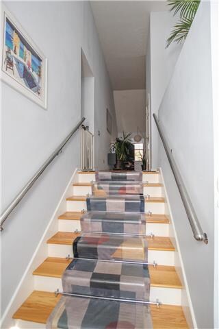The entry foyer has two sets of stairs.  One  leads to the main living area and the other to the huge garage.