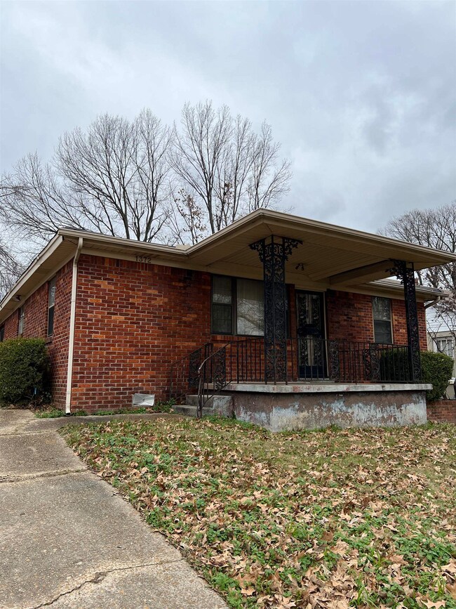 Ranch-style house featuring a porch