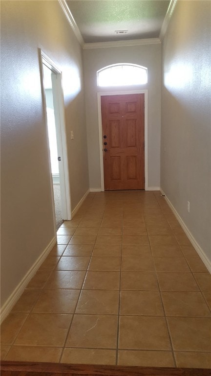 Entryway featuring light tile patterned floors and