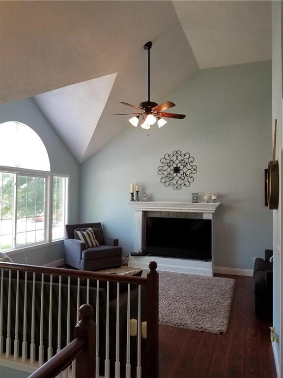 Living room with wood burning fireplace.