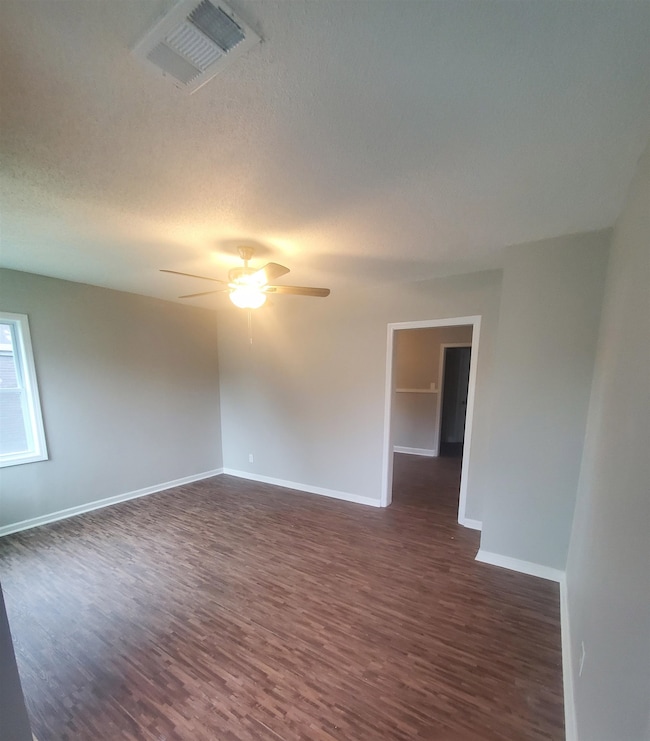 Living room featuring a textured ceiling, ceiling 