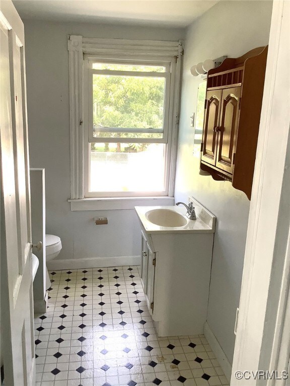 Bathroom with vanity and toilet