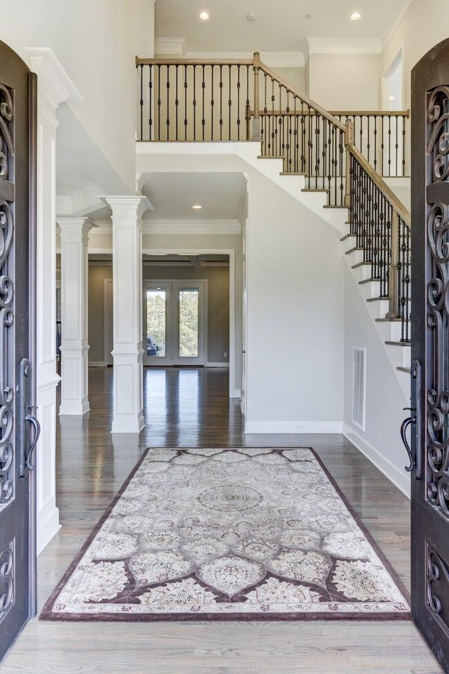 The Grand entrance with the formal staircase welcomes you home. Hardwood flooring stretch as far as you can see.