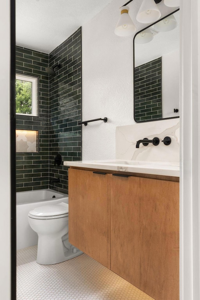 Bathroom with vanity and  shower combination