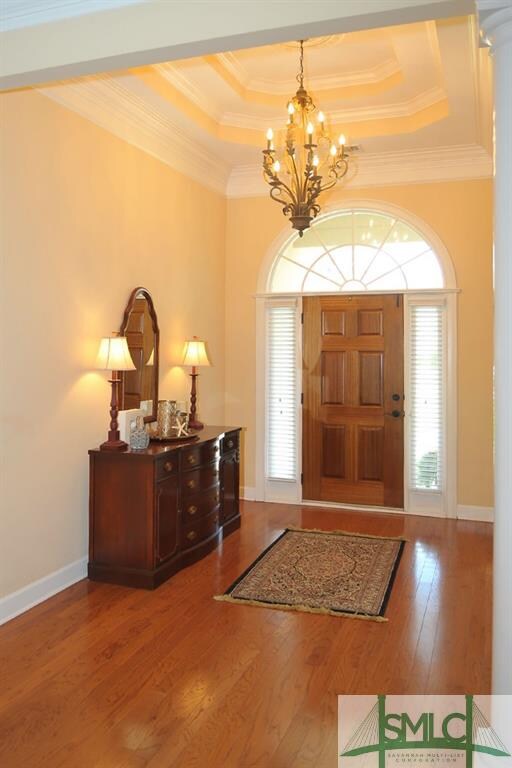The foyer features a double trey ceiling. Note the
