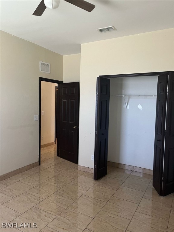Unfurnished bedroom featuring a closet, ceiling fa