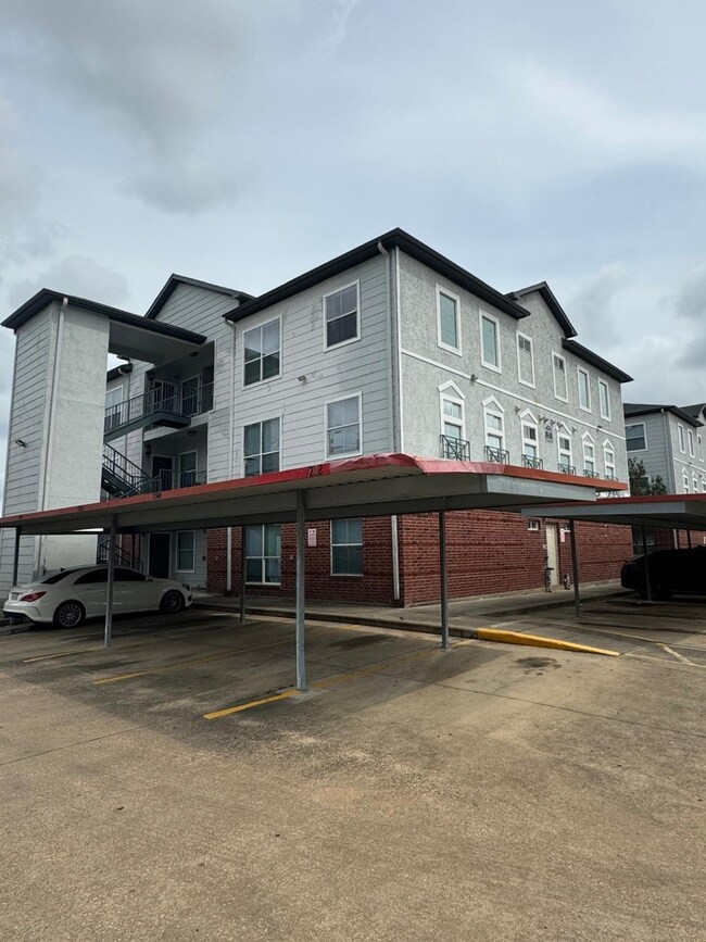 This photo shows a three-story apartment building