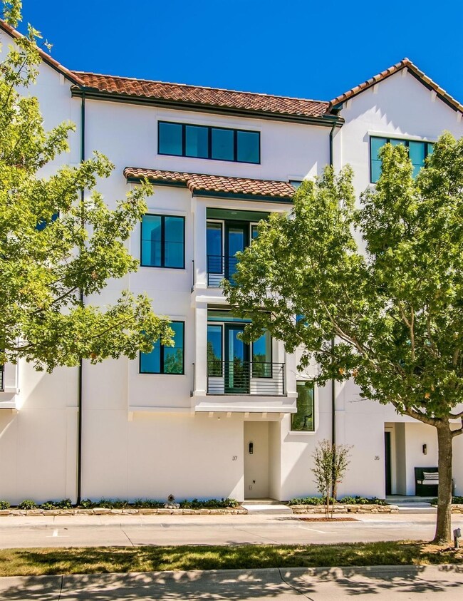 View of front of property with a balcony.