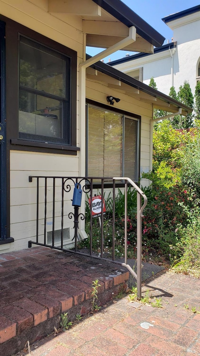 Lockbox location at front of 1241 Grove St.
