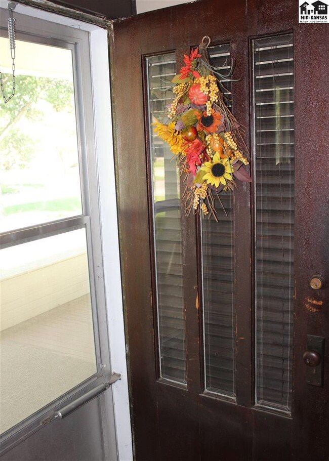 Beveled leaded glass shines in the solid wood door
