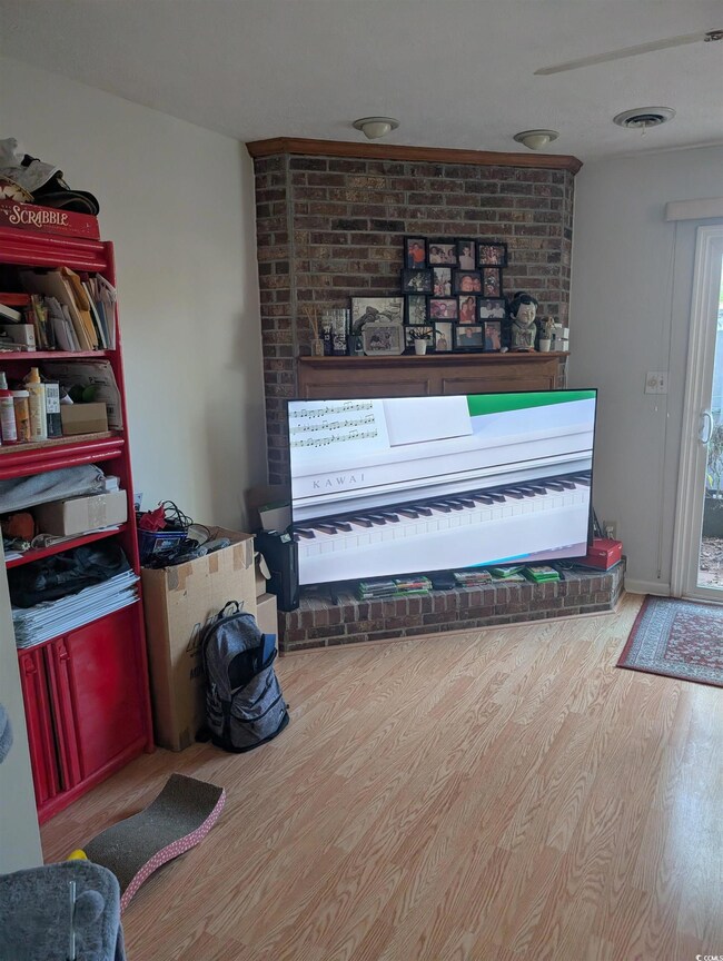 Miscellaneous room with light wood-type flooring