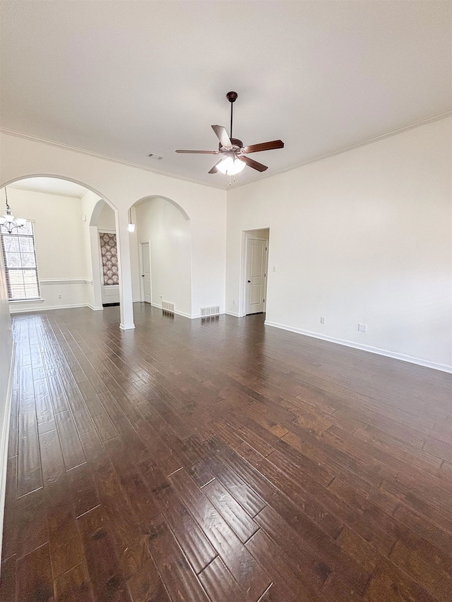 Unfurnished room featuring dark wood-style floors,