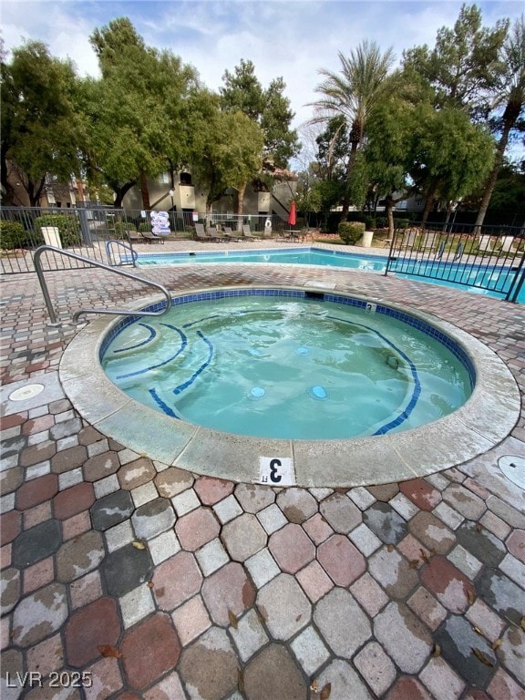 Community pool with a community hot tub