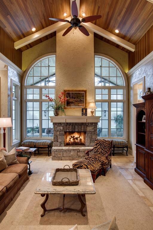 Spacious family room off of kitchen looking out to back garden room