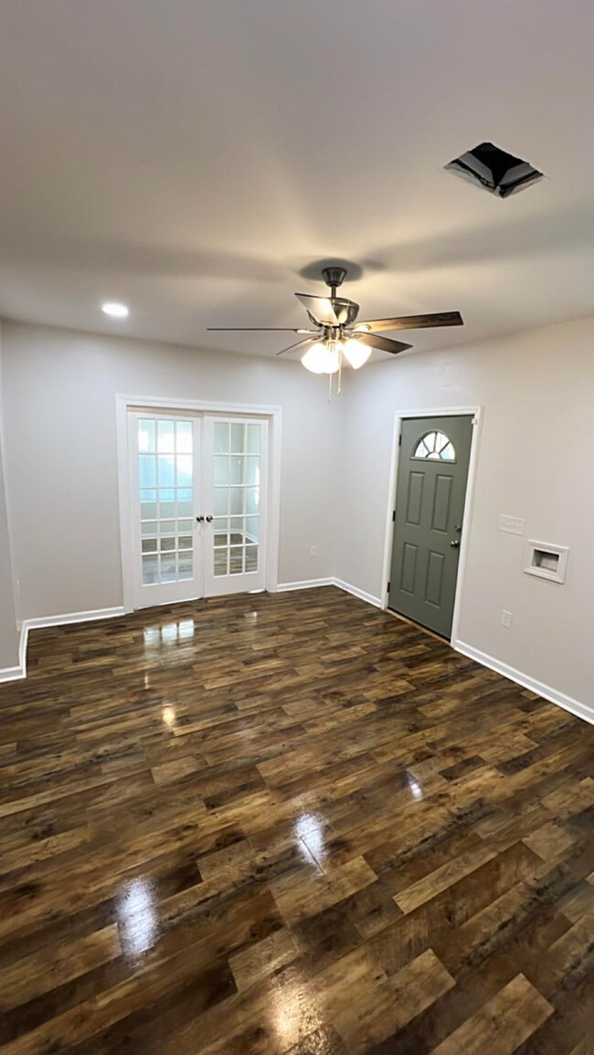 Entryway with dark wood-style floors, ceiling fan, french doors, and recessed lighting