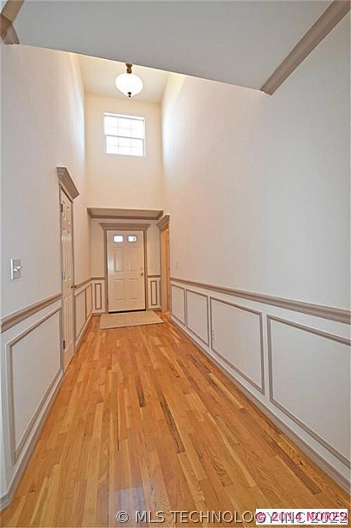 Soaring ceilings in the beautiful entry and window