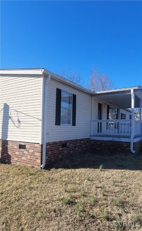 View of property exterior featuring crawl space an