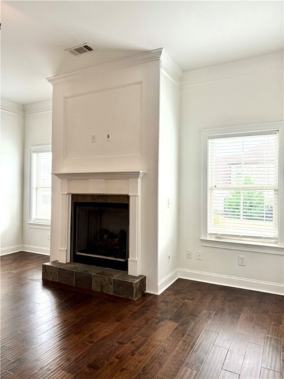 The living room features a ceiling fan and gas fir