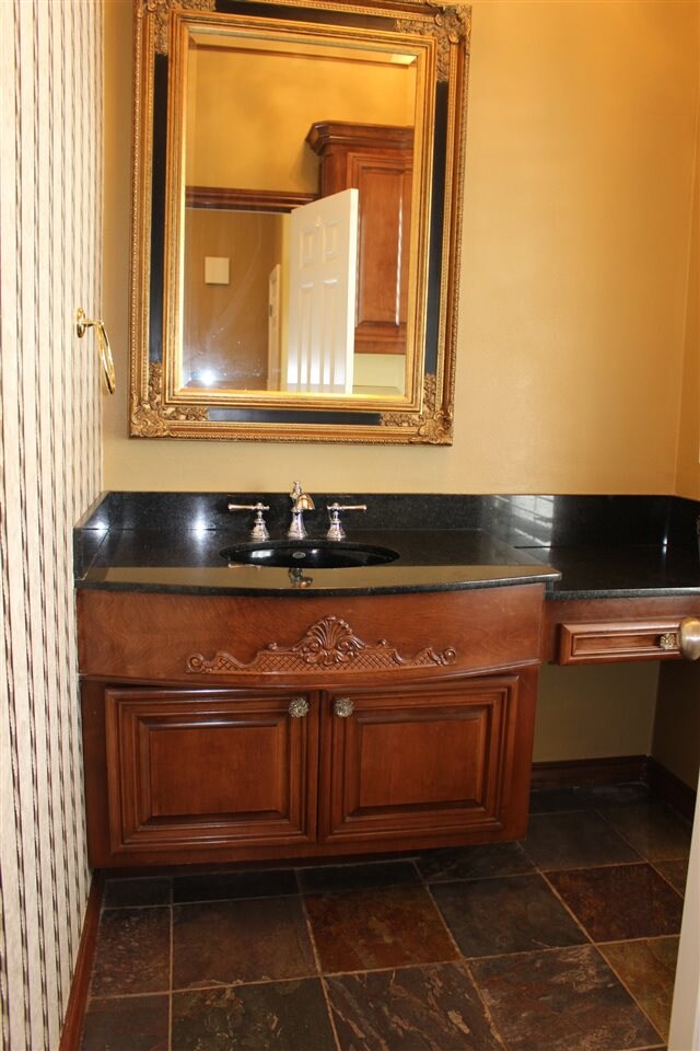 This half bath is located off the foyer and is spa