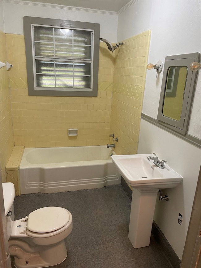 Compact bathroom with vintage charm, featuring yel