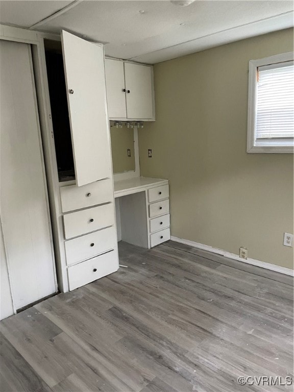 Unfurnished office with wood finished floors