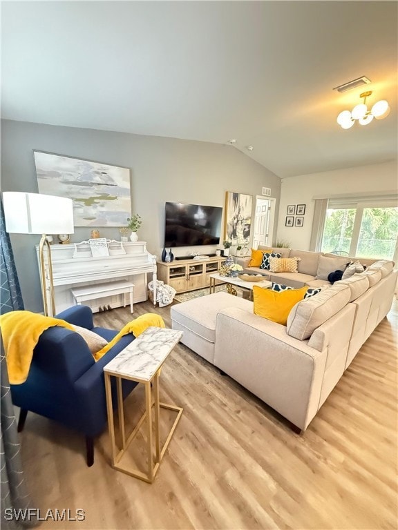 Living room with vaulted ceiling and wood finished