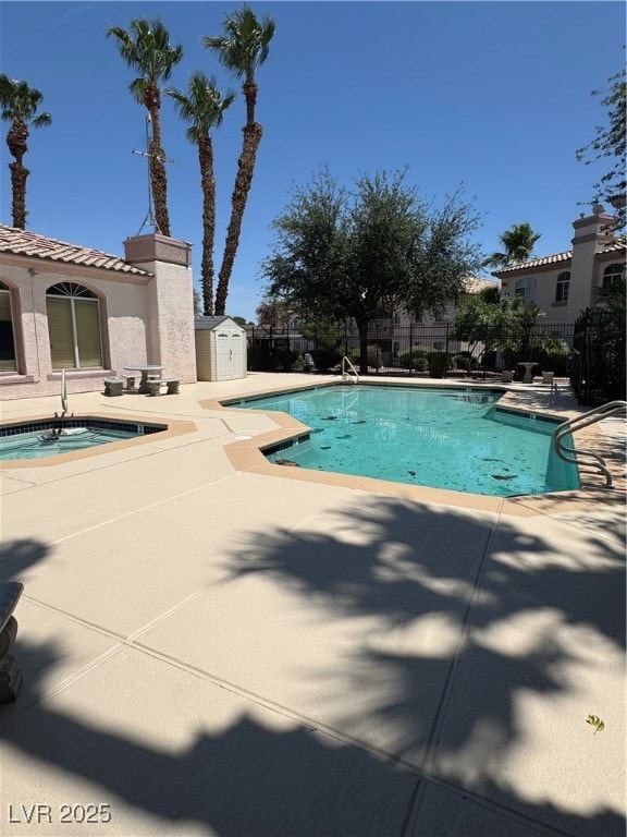 Community pool featuring a patio area