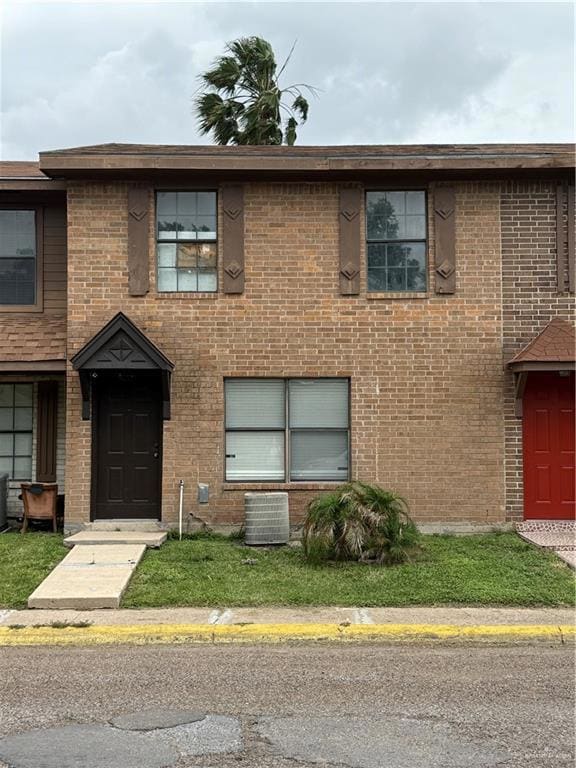 Multi unit property with central air condition unit and brick siding