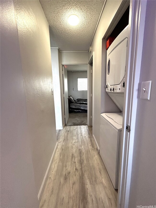 washer/dryer in hallway in between the two bedroom