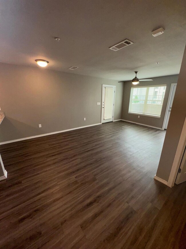 Unfurnished room with dark wood finished floors, v