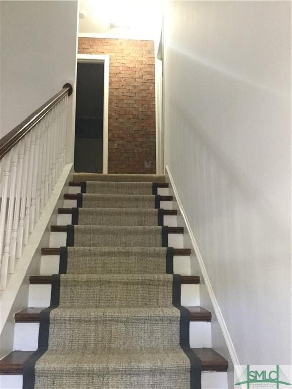Stairs up are wood with a sisal runner. Check out 
