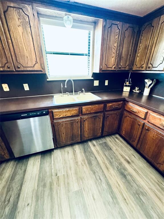 Kitchen featuring stainless steel dishwasher, sink