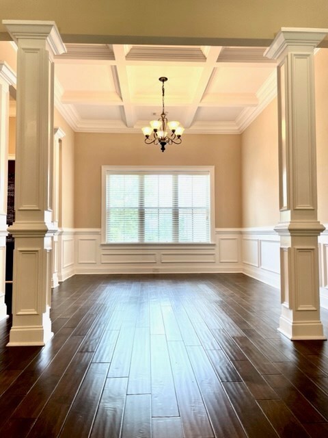 Formal Dining Rm w Cauffered Ceilings & Bold colum