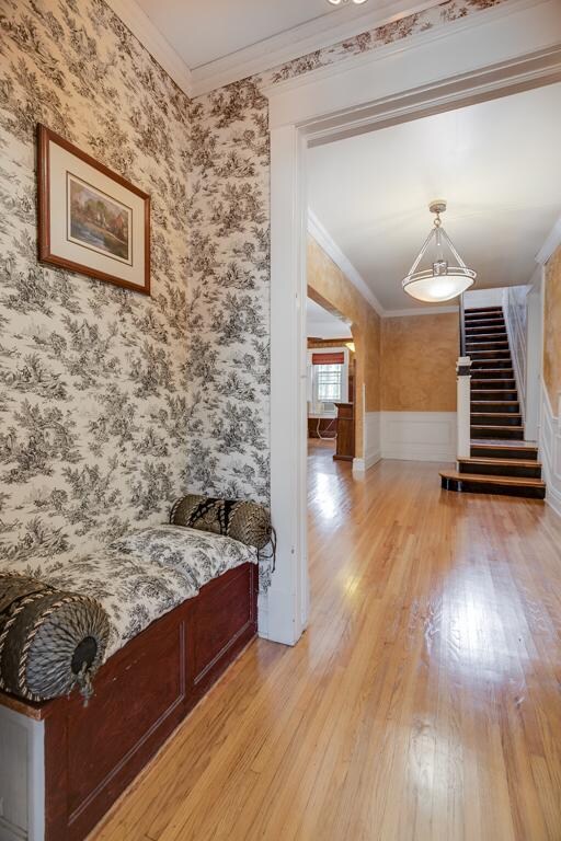 Grand entrance features a built-in bench and a clo
