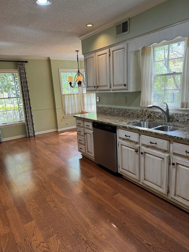 Kitchen featuring plenty of natural light, dishwas