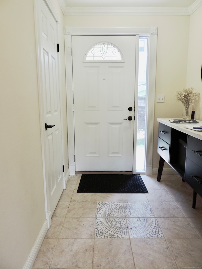Front Door w/ Door to Half Bath