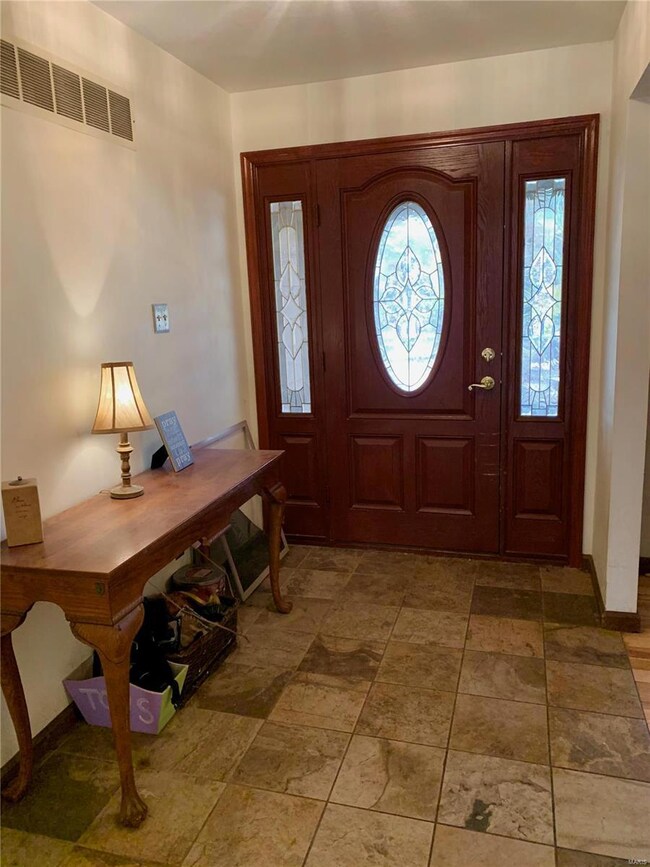 Entry foyer opens to the Living Room on the right.