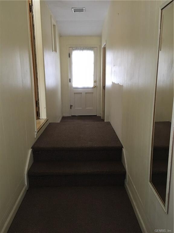 Mudroom entrances from front, back, and garage doo