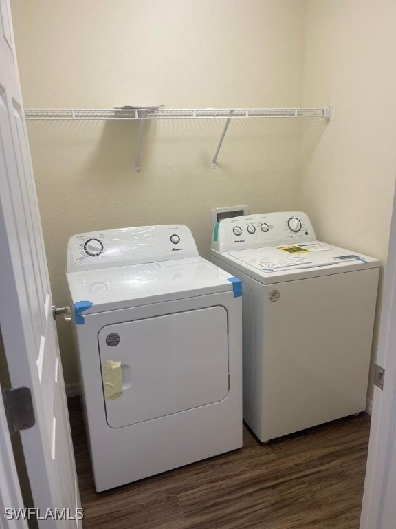 Washroom with separate washer and dryer and dark w
