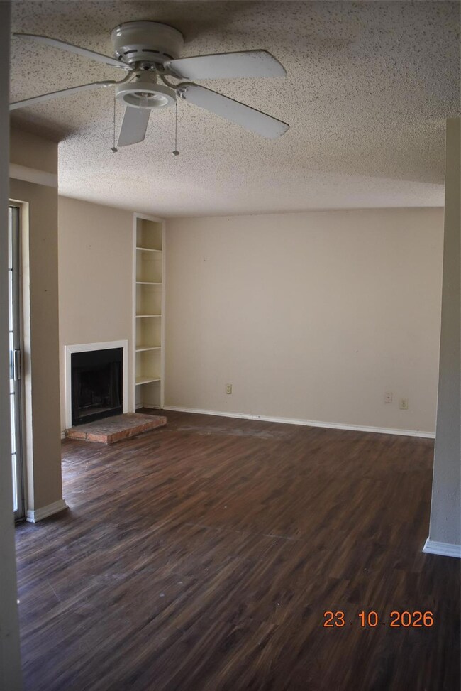 Unfurnished living room with a textured ceiling, d
